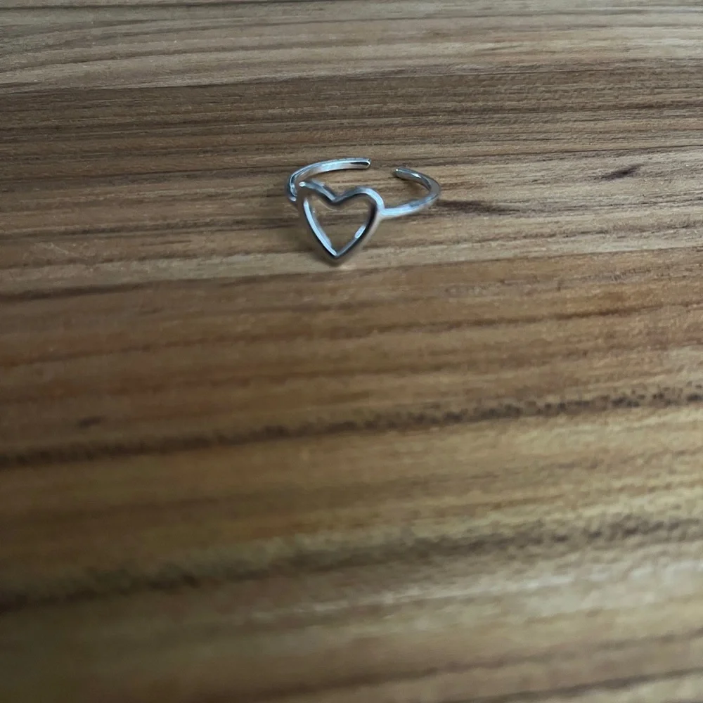 New silver tone heart shaped ring adjustable band one size fits most